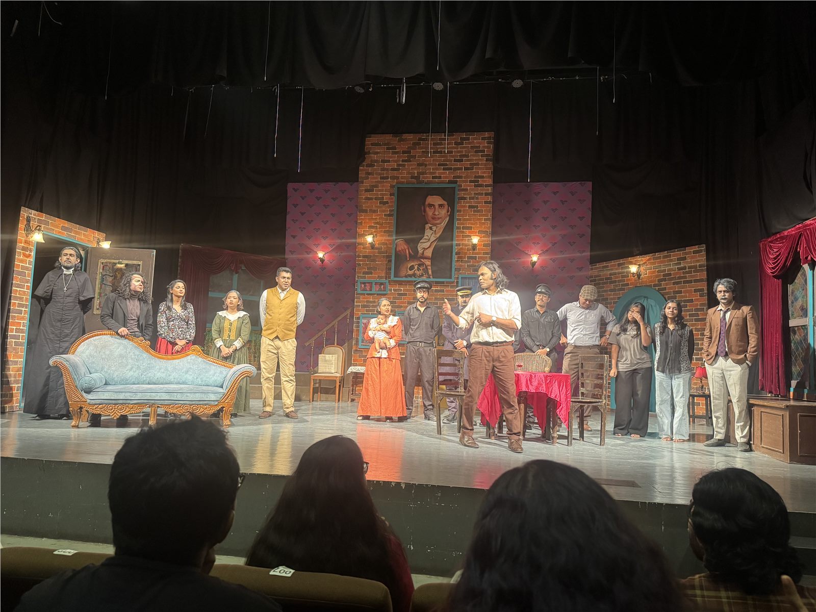 Cast of Arsenic and Old Lace standing together on stage
