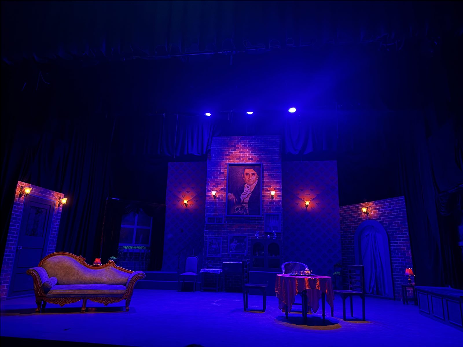 The theatre set illuminated with deep blue light